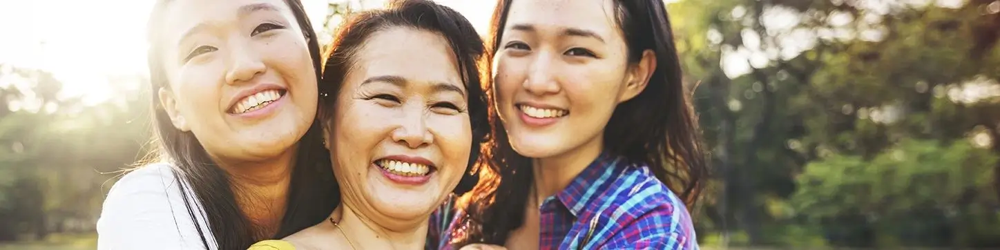 Three women smiling after their dental services visit in Marshall, Texas